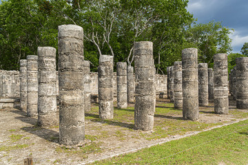 Temple of the Warriors (Templo de los Guerreros) with rows of carved columns in Chichen Itza...