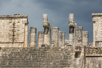Temple of the Warriors (Templo de los Guerreros) with rows of carved columns in Chichen Itza archaeological site. Tinum Municipality, Yucatan State, Mexico.