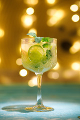 A glass of lemon soda with fresh mint