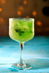 A glass of lemon soda with fresh mint