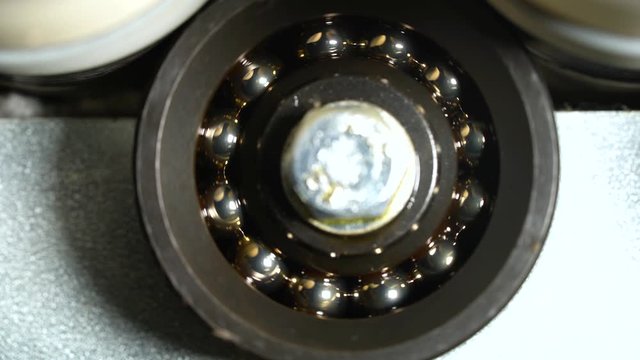 Spinning mechanism of bearing at production tiles. Close up.