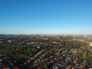 Drone panoramic aerial view of Sydney NSW Australia city Skyline and looking down on all suburbs 