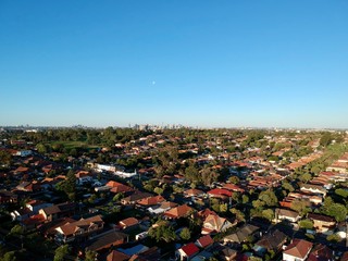 Drone panoramic aerial view of Sydney NSW Australia city Skyline and looking down on all suburbs 