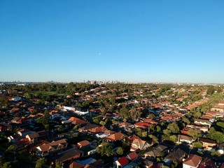 Drone panoramic aerial view of Sydney NSW Australia city Skyline and looking down on all suburbs 