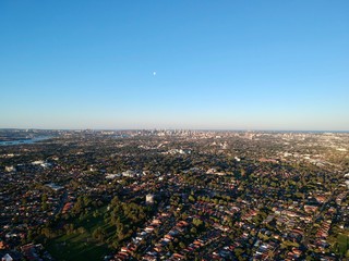 Drone panoramic aerial view of Sydney NSW Australia city Skyline and looking down on all suburbs 