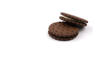 chocolate cream sandwich cookies with cream filling on a white background