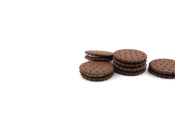 chocolate cream sandwich cookies with cream filling on a white background