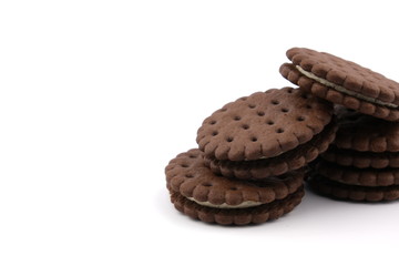 chocolate cream sandwich cookies with cream filling on a white background