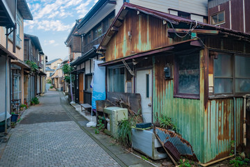 Japan. Streets of the Japanese city. Residential houses away from the city center. Modest homes in Japan. life in Japan. A narrow Japanese street.