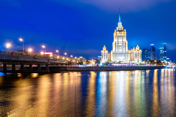 Moscow. Stalin's high-rise buildings. Hotel Ukraine. Evening in Moscow. Reflection of light of lanterns in the river Moscow. Business card of the capital of Russia. Architectural masterpiece.