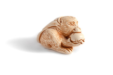 Monkey King. Sun Wukong. symbol of long life and the right choice. patron of martial arts. monkey eating peach. isolated on white background. Feng Shui. netsuke