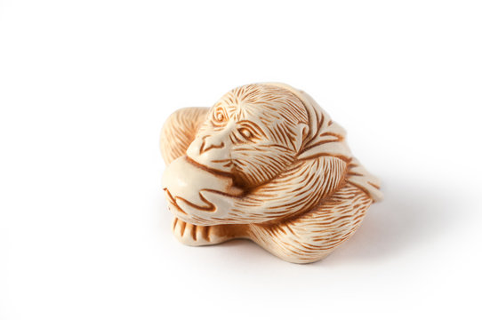 Monkey King. Sun Wukong. symbol of long life and the right choice. patron of martial arts. monkey eating peach. isolated on white background. Feng Shui. netsuke