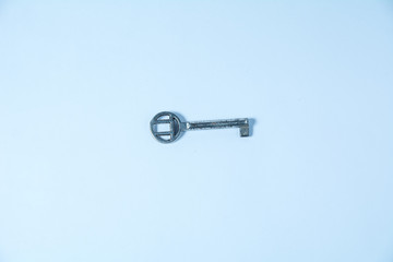 Old key depicted on a white background