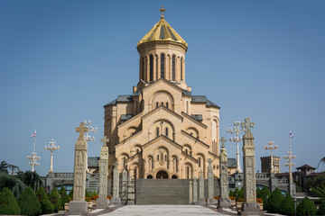 Fototapeta na wymiar Front view of Holy Trinity Cathedral of Tbilisi also known as Tsminda Sameba, orthodox church in sunny day, Georgia