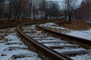 Fototapeta premium A railroad track sleeper on the outskirts of the city.