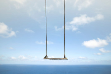 swing without anyone flies free in the sky - obrazy, fototapety, plakaty