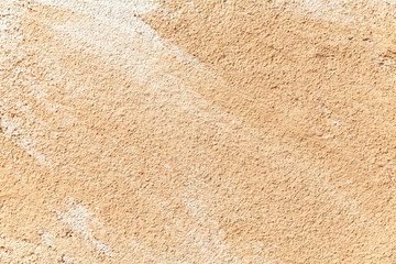 texture and seamless background of brown granite block stone.