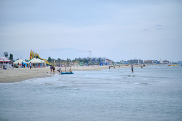 Many people on the beach in cloudy weather