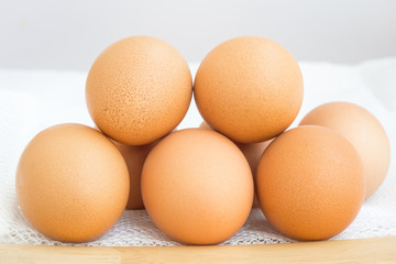 eggs on wood table on white background