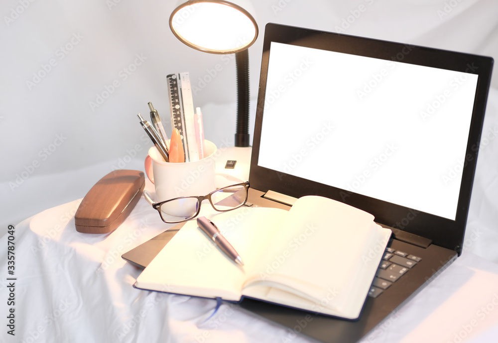 Poster home office table of laptop computer and blank paper background and copy space