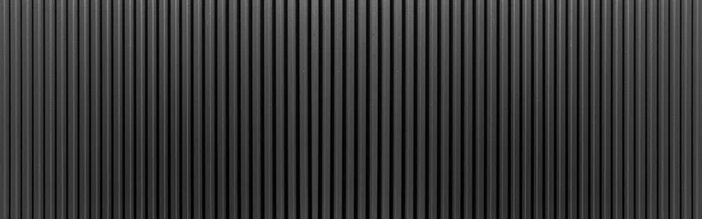 Foto auf Acrylglas Panorama der schwarzen gewellten Metallstrukturoberfläche oder galvanisierter Stahl. © torsakarin