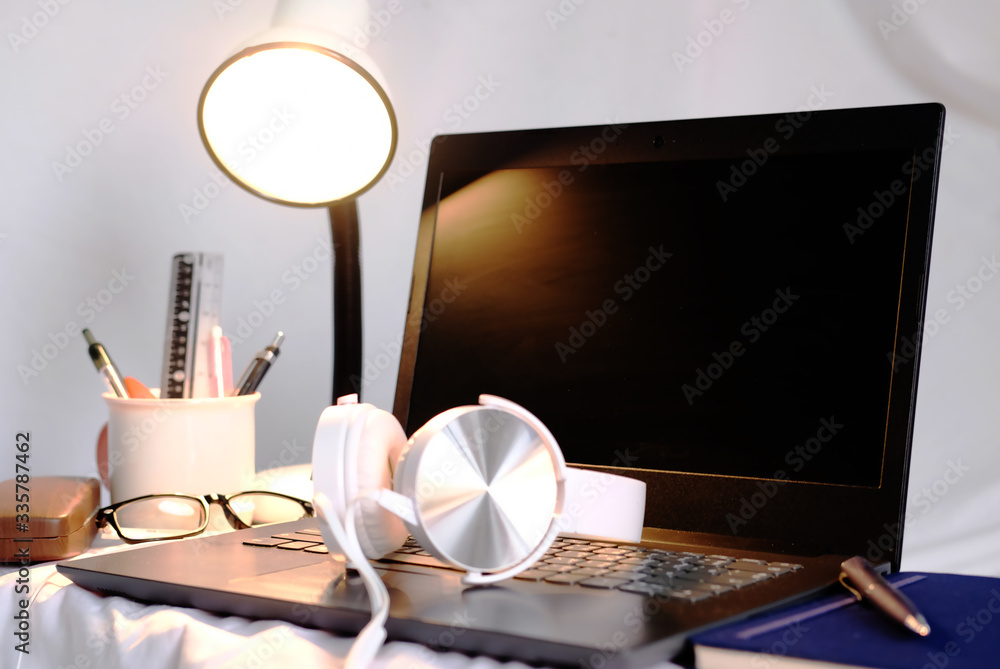 Poster home office table of laptop computer and blank paper background and copy space
