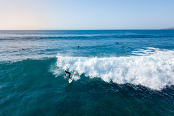 Surfer at the top of the wave