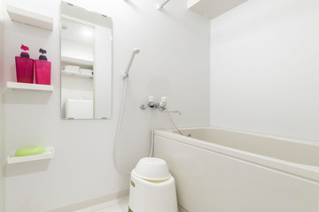 Bath tub in a small bathroom at the apartment