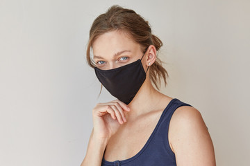 Girl in black medical mask