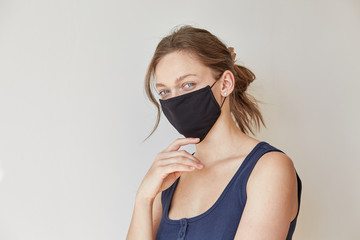 Girl in black medical mask