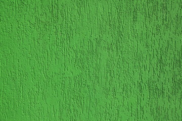 Green wall, texture, background. Plastered building wall, painted with water-based paint. Decorated...
