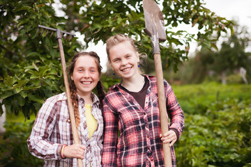  Teenage twin sisters  on farm