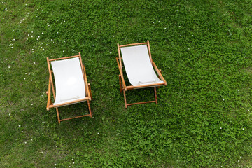 Pair of deck chairs in the garden, top view