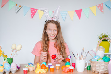 Obraz na płótnie Canvas Happy easter. Beautiful little kid wearing bunny ears on Easter day.