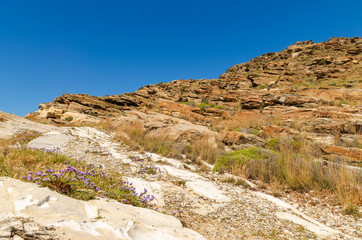 Fototapeta na wymiar Rocky coast on Paros island near Monastiri bay. Cyclades, Greece