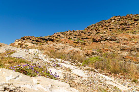 Rocky coast on Paros island near Monastiri bay. Cyclades, Greece