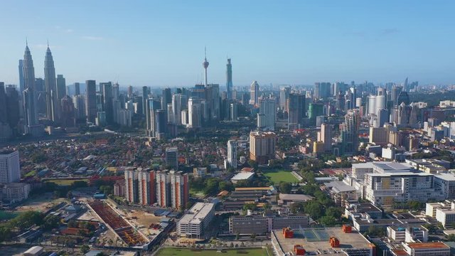 February 23rd, 2020 - Kuala Lumpur, Malaysia : 4k Establishing b-roll aerial shot of drone moving forward towards Kuala Lumpur city skyline.