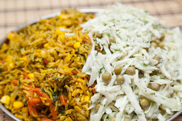 Plate with rice and fresh cabbage salad