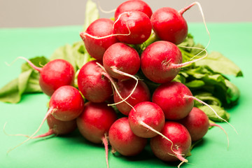 Pile of radishes against green