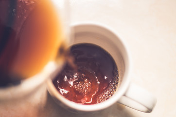 cofee pouring in coffee mugs