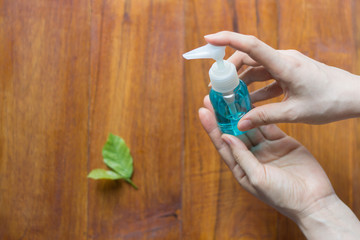 Close up women washing hands with alcohol gel. prevent the spread of germs and bacteria and avoid infections corona virus.