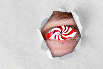 hypnotic eye effect, the macro view of the addicted person with spinned lines in eye