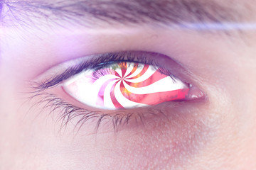 hypnotic eye effect, the macro view of the addicted person with spinned lines in eye