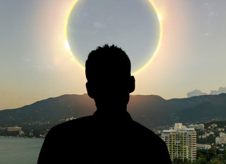 a back view of the person watching the solar eclipse in the sky from the earth, elements of this...