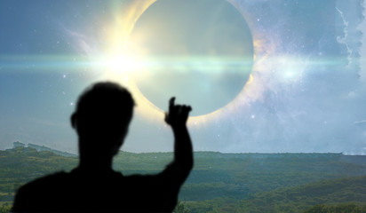 a back view of the person watching the solar eclipse in the sky from the earth, elements of this...