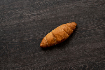 a simple croissant  isolated against the colrful background, traditional french food, minimalism concept