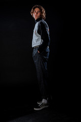 Trendy young guy posing in studio