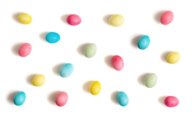 Colorful Easter chicken eggs on a white background. Easter egg pattern.