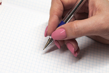 A beautiful manicure. The girl writes.