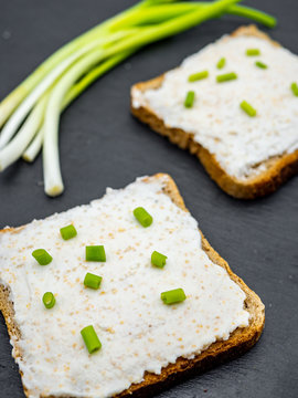 Fish Roe Paste Spread On Bread Slices And Green Onion On Slate Breakfast Snack Concept